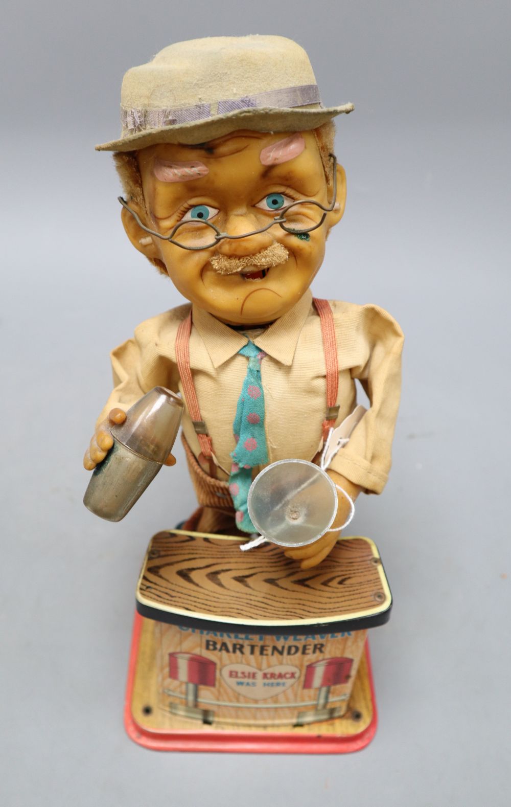 A Charlie Weaver bartender tin battery operated toy